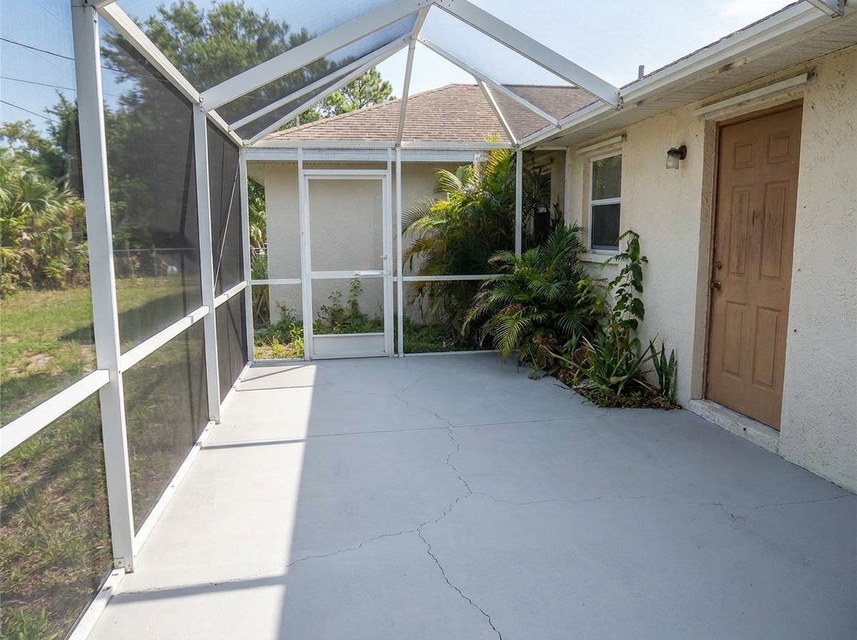 Newly rebuilt screened lanai enclosure on a Florida home